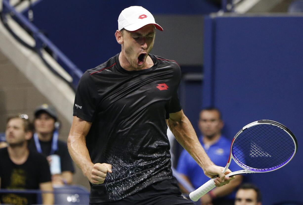 John Millman, of Australia, reacts after winning a point against Roger Federer, of Switzerland, during the fourth round of the U.S. Open tennis tournament, Monday, Sept. 3, 2018, in New York.