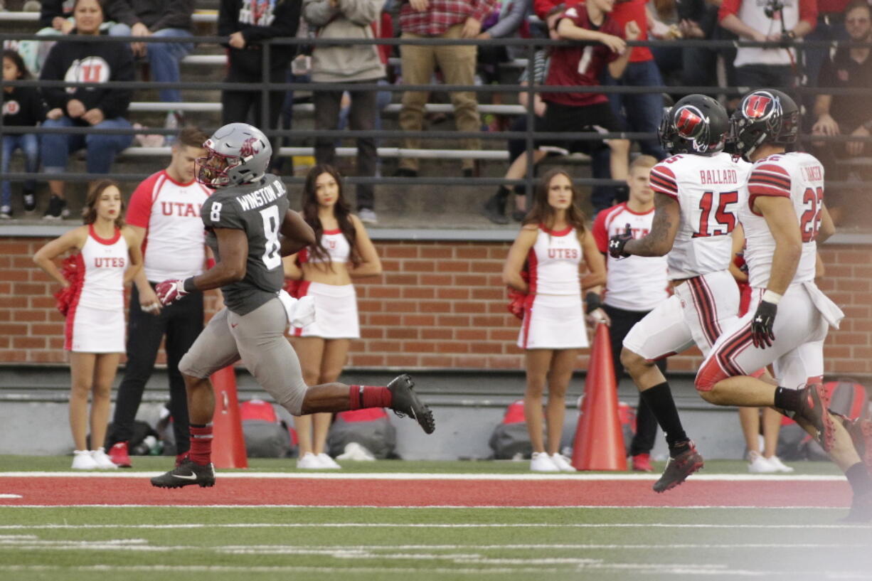 Washington State wide receiver Easop Winston Jr. (8) runs for the go ahead touchdown as he is chased by Utah defensive back Corrion Ballard (15) and linebacker Chase Hansen (22) during the second half of an NCAA college football game in Pullman, Wash., Saturday, Sept. 29, 2018. Washington State won 28-24.