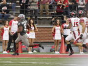 Washington State wide receiver Easop Winston Jr. (8) runs for the go ahead touchdown as he is chased by Utah defensive back Corrion Ballard (15) and linebacker Chase Hansen (22) during the second half of an NCAA college football game in Pullman, Wash., Saturday, Sept. 29, 2018. Washington State won 28-24.