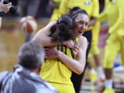 Seattle Storm forward Breanna Stewart, back, celebrates and hugs guard Sue Bird (10) after Game 3 of the WNBA basketball finals against the Washington Mystics, Wednesday, Sept. 12, 2018, in Fairfax, Va. The Storm won 98-82.