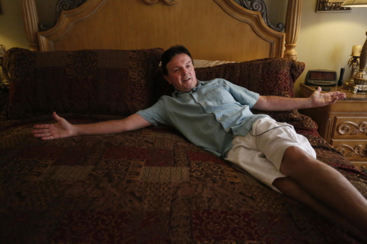 Michael Dart lies on his new waterbed from City Furniture in Coral Springs, Fla. Dart bought a waterbed in the 1980s in Rochester, N.Y. Dart said he missed its comforting warmth.