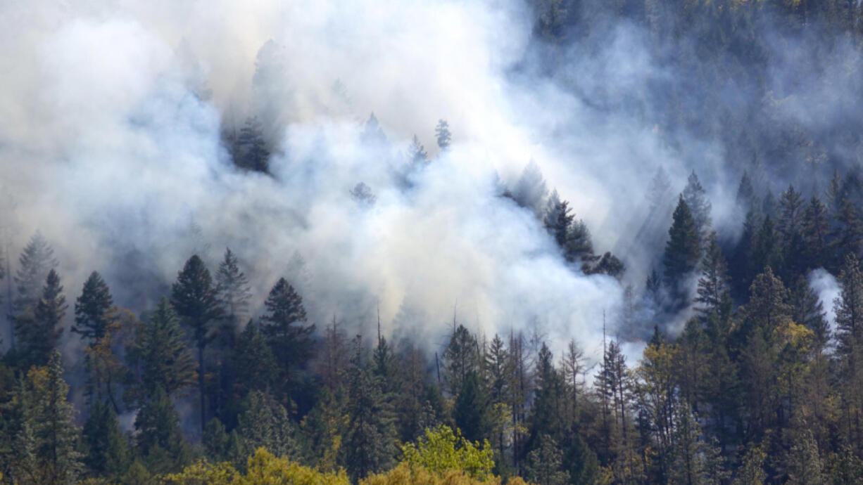 Smoke covers a hillside in the Applegate Valley of southwestern Oregon during a prescribed burn operation.