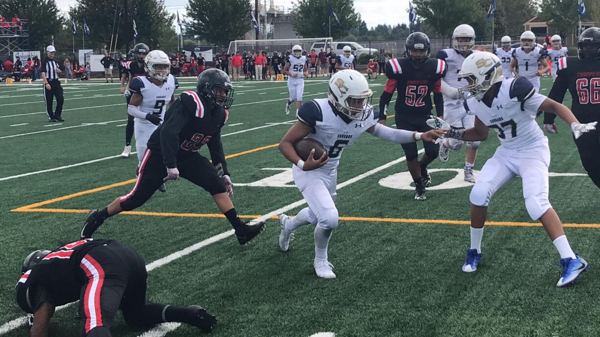 Seton Catholic's CJ Hamlin finds running room for a first down Saturday in the Cougars' 40-0 win over Fort Vancouver.