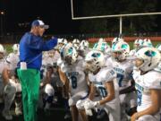 Mountain View head football coach Adam Mathieson talks to his players after the Thunder's 54-7 victory Friday over Juanita in Kirkland.