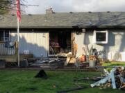 Camas-Washougal firefighters rescued a man and his two dogs from this home on Feb. 14 after a small kitchen fire spread, causing smoke to fill the residence.