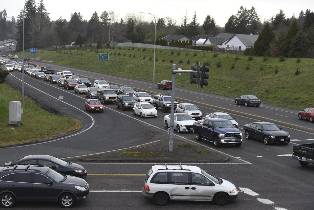 Vehicles traveling east on state Highway 500 wait at the stoplight at the intersection of Northeast 42nd Avenue/Falk Road during rush hour in February. Crews working for the Washington State Department of Transportation plan to remove the stop lights at the intersections of Northeast 42nd Avenue/Falk Road and Northeast 54th Avenue/Stapleton Road and replace them with right-in/right-out interchanges.