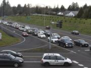 Vehicles traveling east on state Highway 500 wait at the stoplight at the intersection of Northeast 42nd Avenue/Falk Road during rush hour in February. Crews working for the Washington State Department of Transportation plan to remove the stop lights at the intersections of Northeast 42nd Avenue/Falk Road and Northeast 54th Avenue/Stapleton Road and replace them with right-in/right-out interchanges.