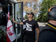 Joey Gibson, center, and others in the Patriot Prayer movement gather in Vancouver before an Aug. 4 rally in Portland.