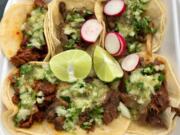 Pastor, asada, lengua and pollo tacos from Delicious Tacos.