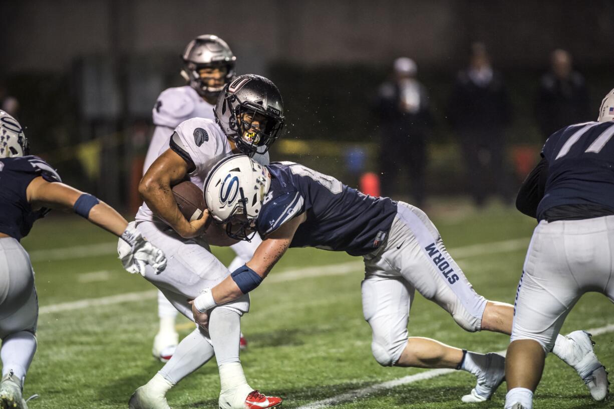 Union's Joseph Siofele is stopped by a Skyview defender during the fourth quarter at the Kiggins Bowl on Friday night, Oct.