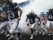 The Skyview Storm run onto the field at the beginning of their game against Union at the Kiggins Bowl on Friday night, Oct.