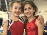 Local gymnasts Athena Lee, left, and Hadley Palmerton were selected to compete in Indianapolis this month in the USA Gymnastics Talent Opportunity Program, which seeks to identify youths with the potential to become elite gymnasts.