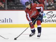 Washington Capitals right wing T.J. Oshie (77) skates with the puck during the second period of an NHL preseason hockey game against the St. Louis Blues, Sunday, Sept. 30, 2018, in Washington.