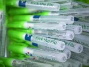 Free hand sanitizers are given out during the Kick The Flu event for hospital employees at Legacy Salmon Creek Medical Center in October 2018.