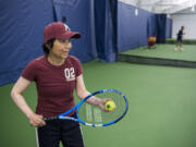 Akemi Noll plays tennis with her husband, Joe, at Vancouver Tennis Center. She was diagnosed with Parkinson’s disease 12 years ago and used a wheelchair for a majority of those years. She recently gained more mobility after a deep brain stimulation surgical treatment. She now plays tennis three times a week and wants to try skiing.