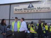 Rep. Jaime Herrera Beutler, from left, chats with Mike O’Toole, president of Great Western Malting, and Kris Johnson, president and CEO of Association of Washington Business, during a visit Friday morning to the Port of Vancouver.