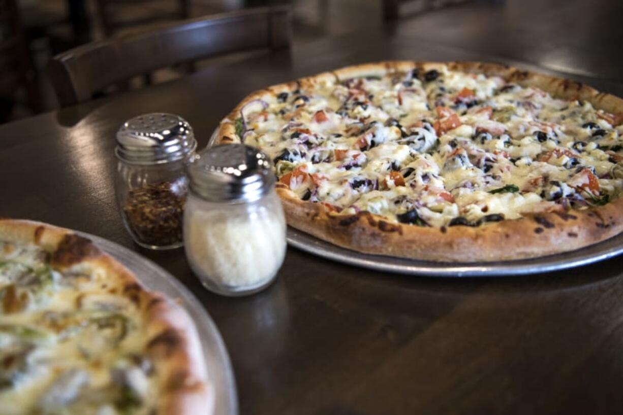 The Leonardo pizza, left, and the Donatello pizza, right, at Vancouver Pizza Company.