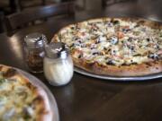 The Leonardo pizza, left, and the Donatello pizza, right, at Vancouver Pizza Company.