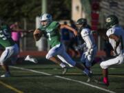 Mountain View's Jack Mertens runs the ball against Evergreen at McKenzie Stadium on Thursday night, Oct. 11, 2018.