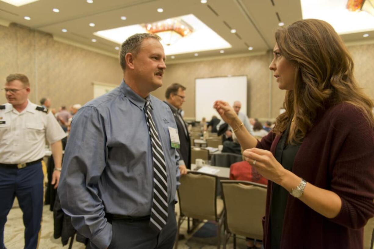 After accepting the Pacific Northwest Waterways Association’s Legislator of the Year award, Rep. Jaime Herrera Beutler talks with Port of Kalama Commissioner Troy Stariha.