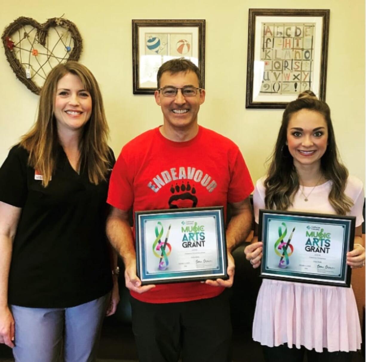 Landover-Sharmel: California Casualty’s Erica Reich, from left, presents a Music and Arts Grant to Endeavour Elementary School teachers Rocky Baker and Grace Klodt to help fund art projects for their classes.