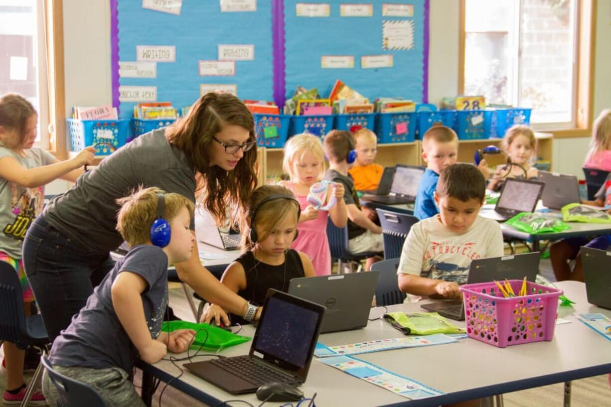 Woodland: Woodland Intermediate School second-grade teacher Amy Craig and her students work on reading skills through the Book Buddies program. Patti Cutler’s fourth-graders visit the class on Fridays to read aloud with a partner.