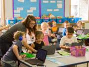 Woodland: Woodland Intermediate School second-grade teacher Amy Craig and her students work on reading skills through the Book Buddies program. Patti Cutler’s fourth-graders visit the class on Fridays to read aloud with a partner.