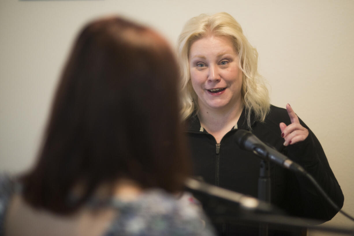 Kimberly Berry, right, records a conversation about domestic abuse and sexual assault with Rebecca Lomeland, a licensed mental health counselor, for her podcast “Being Unnormal” in her dining room in Camas.