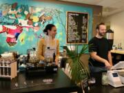 Seidy and Matthew Selivanow behind the counter of their new Coffee Lab.