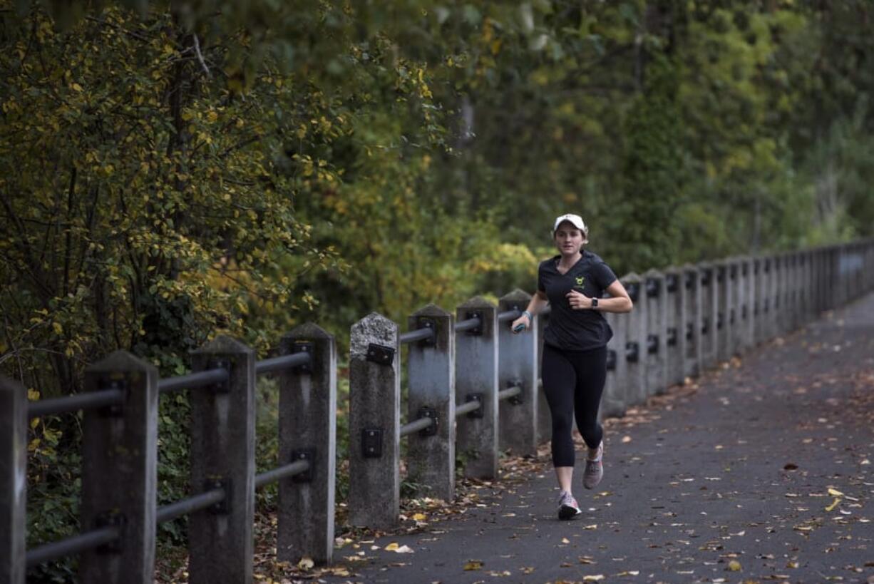 Kirsten Myers of Vancouver runs along the Vancouver Waterfront Renaissance Trail. Myers has joined fellow runners with Type 1 diabetes to run the New York City Marathon next month on the Beyond Type 1 team. The team aims to spread awareness and inspire others with Type 1 diabetes.