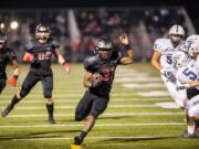 Camas' Jacques Badaloto-Birdsell runs the ball against Skyview at Doc Harris Stadium on Friday night, Oct. 19, 2018.