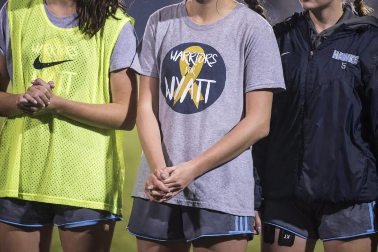 A Hockinson player wears a shirt supporting Wyatt Draper before a match against Woodland at Hockinson High School.