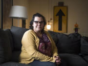 Julie Beckwith poses for a photo in her Vancouver home on Tuesday afternoon. Beckwith was a vendor for LuLaRoe clothing from October 2015 to February 2017. At top, a rack of LuLaRoe shirts is seen at Spanky’s Legendary Consignment on Tuesday afternoon.