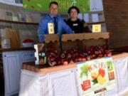 Fircrest: Jodee Nickel, Washington State University Extension’s Supplemental Nutrition Assistance Program Education educator, left, and Chad Kirby of Chartwells Food Service at Fircrest Elementary School for the Harvest of the Month program.