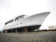 Reader Charles Stookey submitted a question to Clark Asks: “What’s with the abandoned white yacht at the old Kaiser shipyard?” We’re asking our readers for help in answering his inquiry. Below, looking up at the hull of the old yacht.