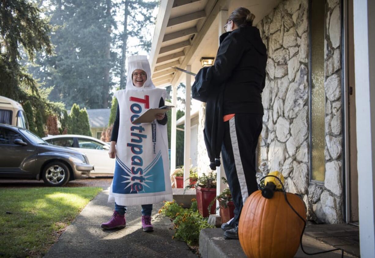 With Halloween just a day away, Heidi Cody, a supporter of Initiative 1631, wore a toothpaste costume while out promoting the climate change initiative.