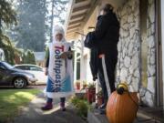 With Halloween just a day away, Heidi Cody, a supporter of Initiative 1631, wore a toothpaste costume while out promoting the climate change initiative.