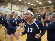 Skyview's Tyra Schaub (center right) celebrates with her team following a victory over Camas at Hudson's Bay High School on Tuesday night, Oct. 30, 2018.