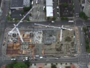 Two huge cranes were part of downtown’s skyline during construction on Vancouvercenter, where the first three towers were completed a decade ago. This photo shows construction in June 2001.