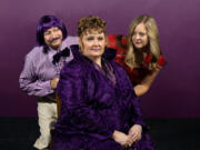 The easily excitable Queen Violet (Kristen Noel, center) tries staying cool while besieged by her slithering manservant, Panini (Tony Provenzola) and the way-too-perfect Princess Scarlett Sonata (Honor Stevenson) in Magenta Theater’s revival of “Once Upon a Palace Purple.” (Stephanie Roberts/Fetching Photos)