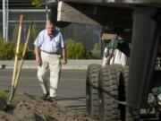 Dave Christensen watches as the 157-foot yacht Barchetta, built by Christensen Yachts in Vancouver, got stuck on S.E. Marine Park Way, as workers tried to make a tight corner on the way to the boat launch on May 4, 2006.