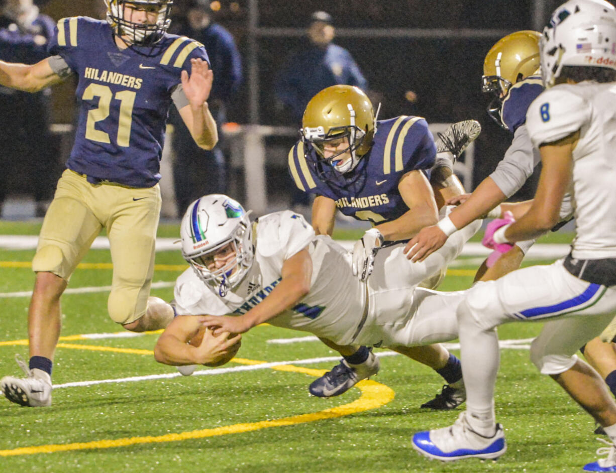 Mountain View's Jack Mertens dives for extra yardage after a 27-yard burst that set up the Thunder's first score. He's finally taken down by Kelso's Dillon Davis.