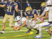 Mountain View's Jack Mertens dives for extra yardage after a 27-yard burst that set up the Thunder's first score. He's finally taken down by Kelso's Dillon Davis.