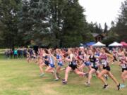 Runners race from the start line at the 2A-1A District IV Cross Country Championships on Thursday at Lewis River Golf Course (Micah Rice/The Columbian)