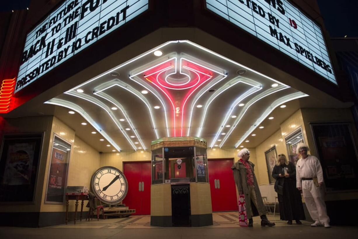 Kiggins Theatre owner Dan Wyatt, left, is dressed as a character from the “Back to the Future” trilogy as he welcomes moviegoers to a “Back to the Future” franchise festival in 2015.