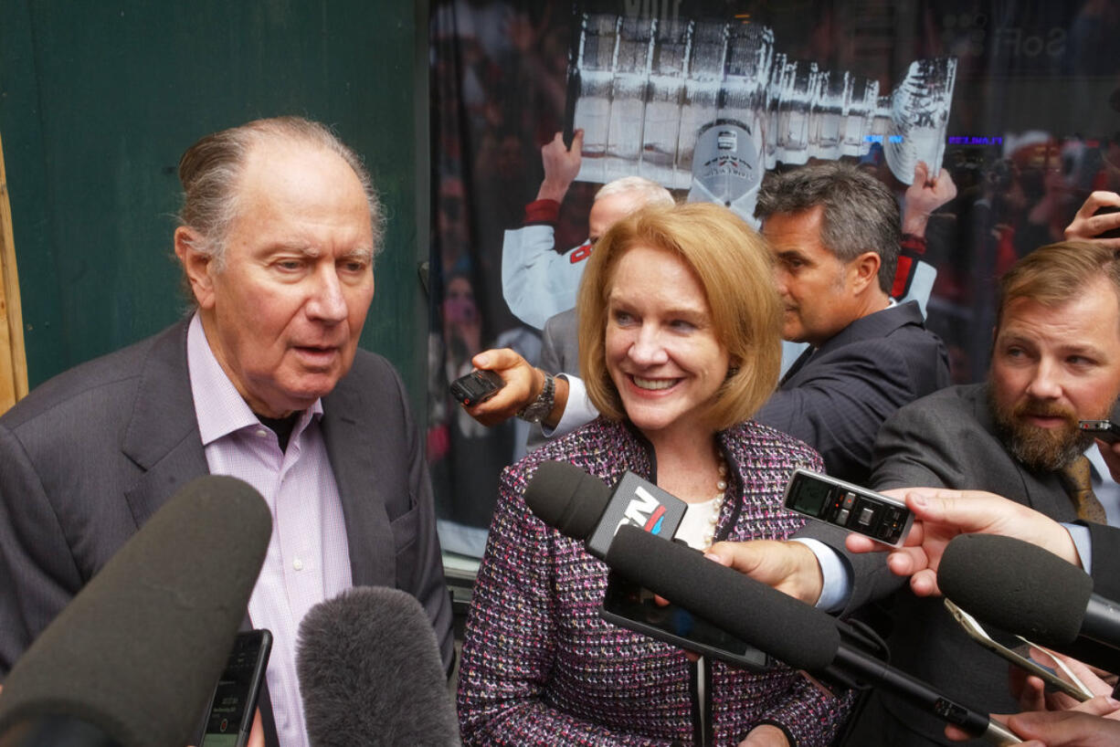 Seattle Hockey Partners David Bonderman, left, and Seattle Mayor Jenny Durkan talk to the media as they leave a meeting at National Hockey League headquarters, Tuesday, Oct. 2, 2018, in New York. Members of Seattle's potential ownership group and Mayor Durkan presented their case to the Board of Governors' executive committee at the league office. If the executive committee moves the process forward, the board could vote as soon as December to award the NHL's 32nd franchise to Seattle.