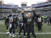 Seattle Seahawks head coach Pete Carroll gestures to his players before playing the Los Angeles Rams, Sunday, Oct. 7, 2018, in Seattle.