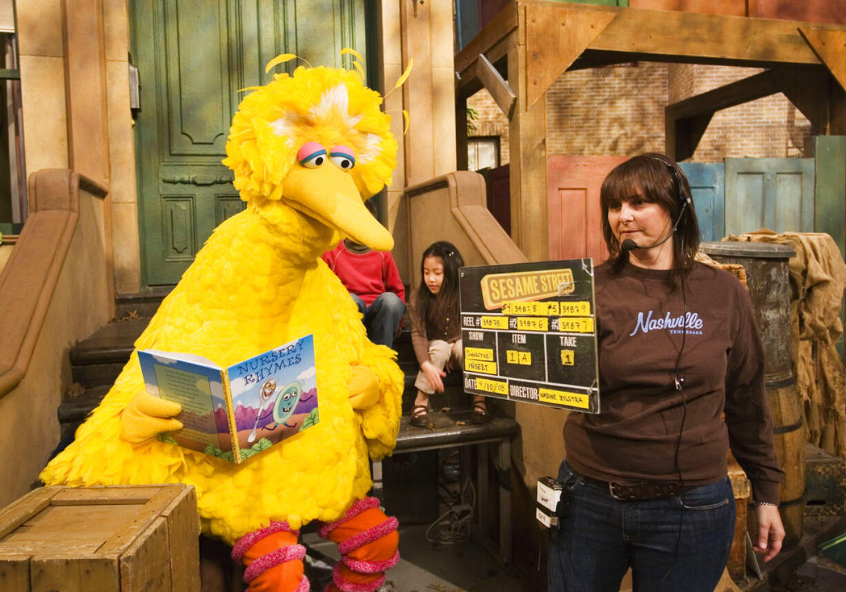 FILE- In this April 10, 2008, file photo Lynn Finkel, stage manager for "Sesame Street" slates a taping with Big Bird in New York. The puppeteer who has played Big Bird on "Sesame Street" is retiring after nearly 50 years on the show. Caroll Spinney tells the New York Times that Thursday, Oct. 18, 2018, will be his last day on the program, which he joined from the start in 1969. In addition to Big Bird, the 84-year-old was also Oscar the Grouch.