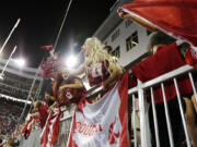 FILE - In this Sept. 9, 2017, file photo, Washington State fans cheer during the second half of an NCAA college football game between Washington State and Boise State in Pullman, Wash. After 15 years of the Washington State flag begin a backdrop fixture to every “College GameDay” broadcast, ESPN is coming to Washington State on Saturday.