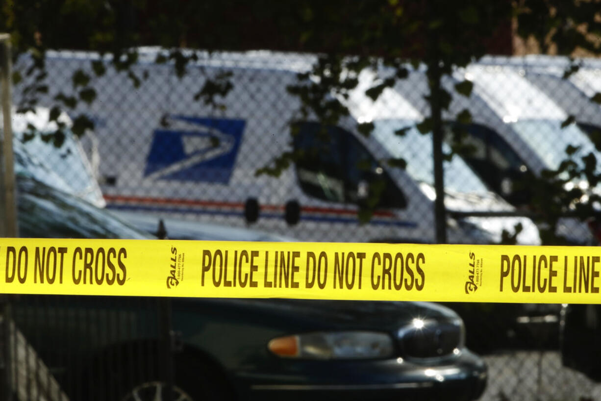 Police tape cordons off a post office in Wilmington, Del., Thursday, Oct. 25, 2018.  A law enforcement official said suspicious packages addressed to former Vice President Joe Biden  were intercepted at Delaware mail facilities in New Castle and Wilmington and were similar to crude pipe bombs sent to former President Barack Obama, Hillary Clinton and CNN.